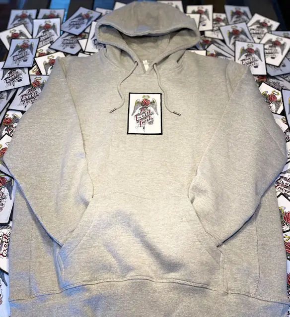 A gray hoodie with a picture of a person on it.