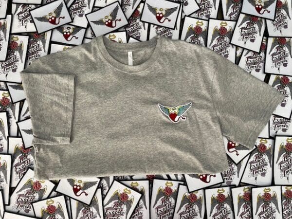 A gray shirt with an image of a bird on it.